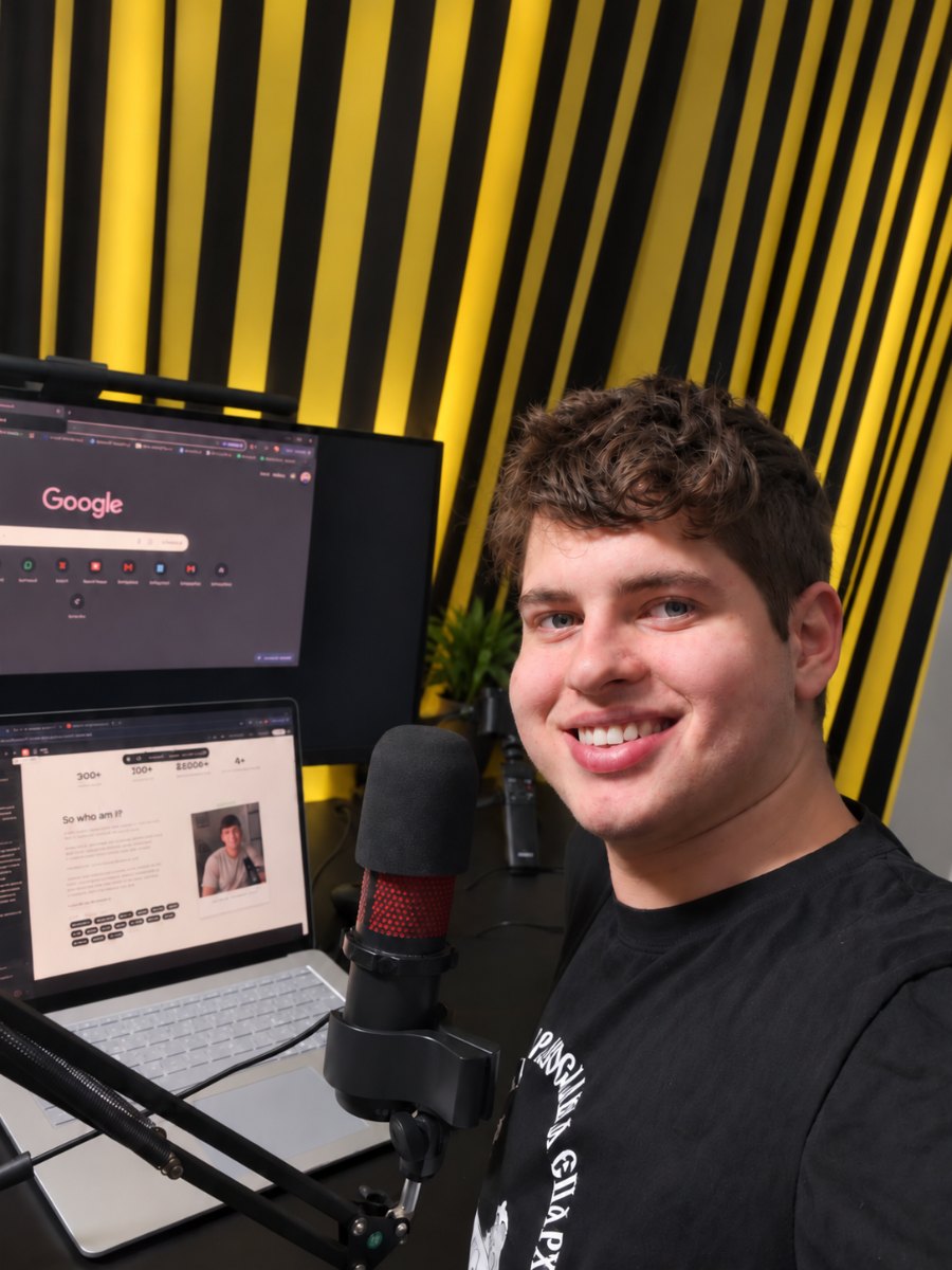 Jovan at his desk — mic in front of him, his own site open on the laptop behind